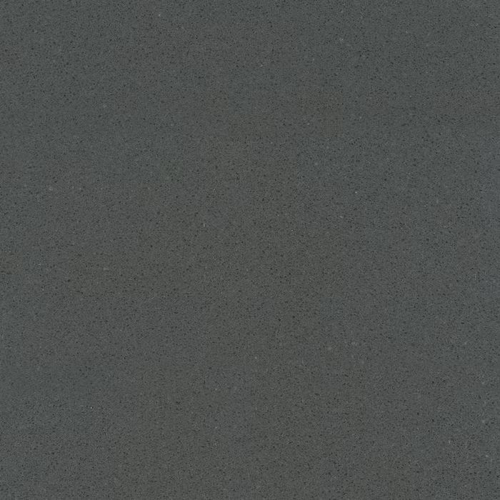 Un primer plano de una superficie gris con una textura granulada.