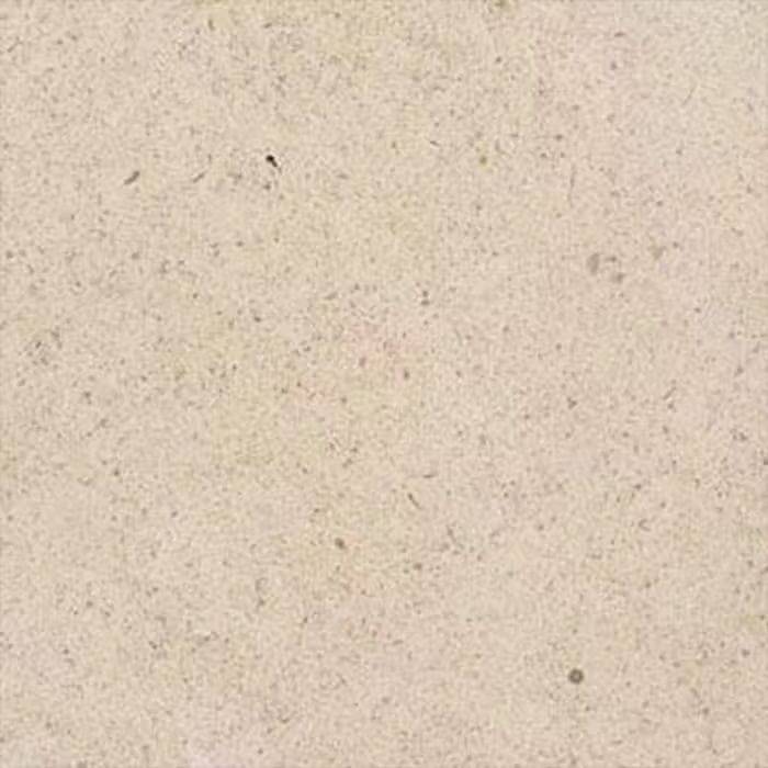 Un primer plano de un azulejo blanco con textura granulada.