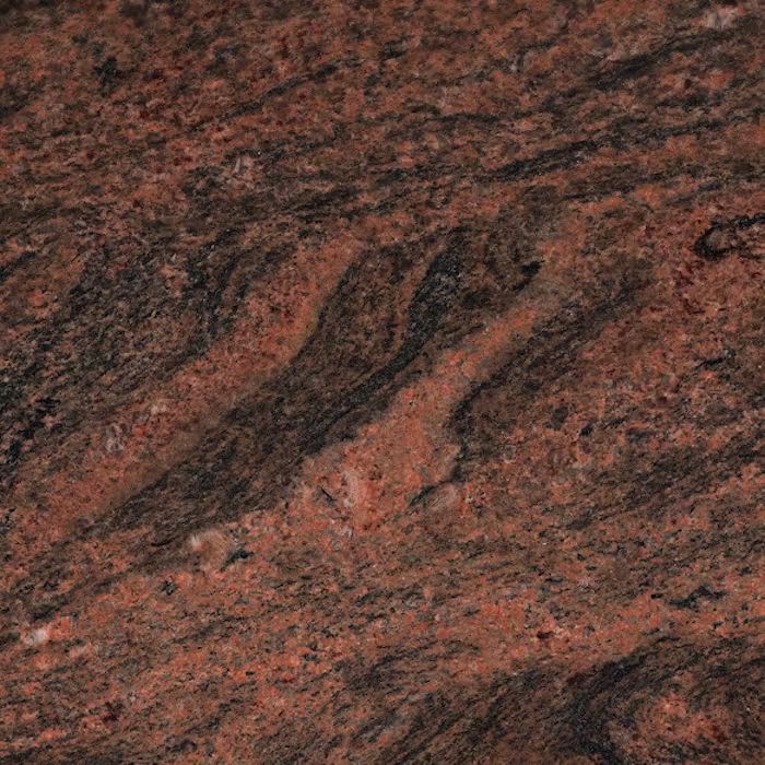 Un primer plano de una encimera de granito rojo.