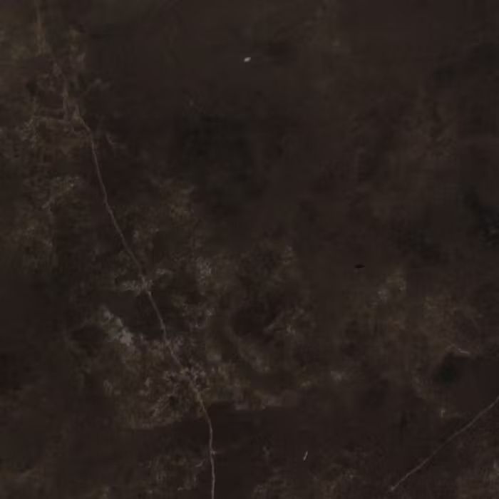 Un primer plano de una textura de mármol marrón oscuro.