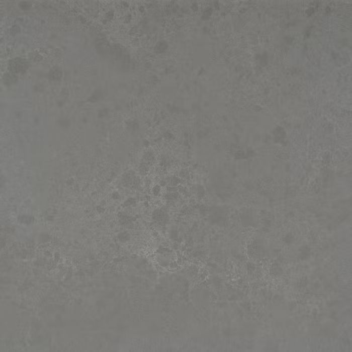 Un primer plano de un azulejo gris con textura granulada.