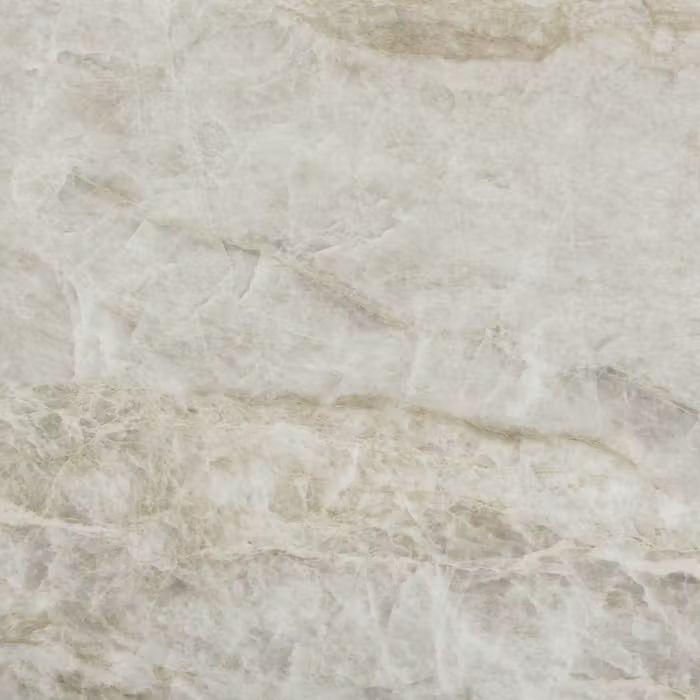 Un primer plano de una hoja de papel con textura de mármol.