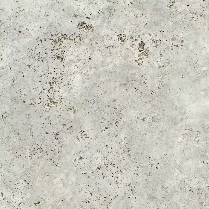 Un primer plano de una superficie de hormigón con pequeños agujeros