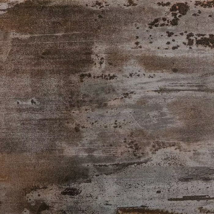 Un primer plano de una superficie de metal oxidado.