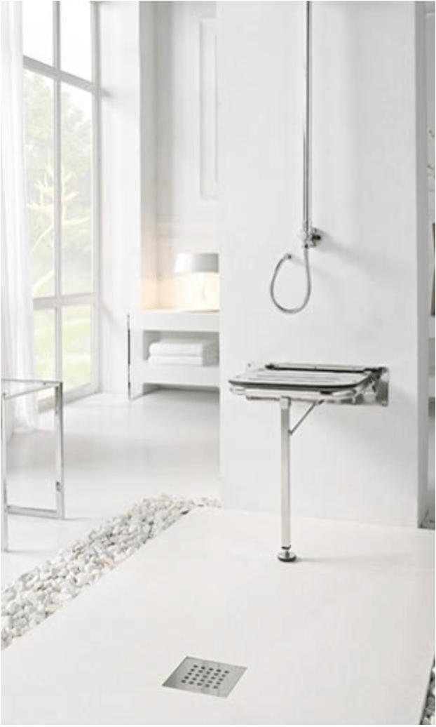 Un baño blanco con lavabo y ducha.