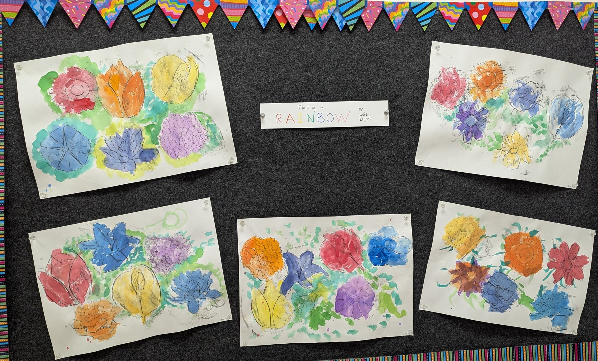 A bulletin board with a bunch of flowers painted on it
