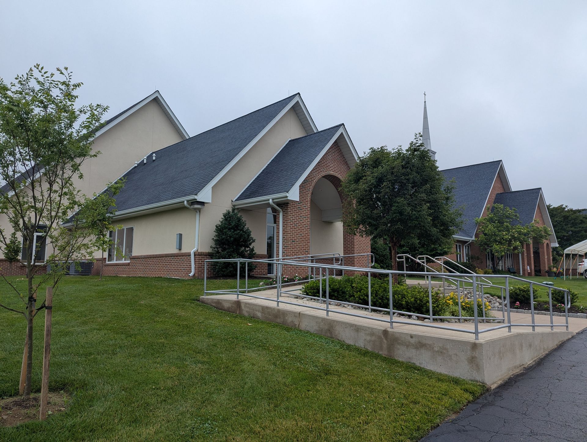 A church with a handicap ramp in front of it