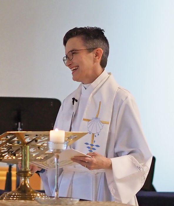 Pastor Karen standing at the altar