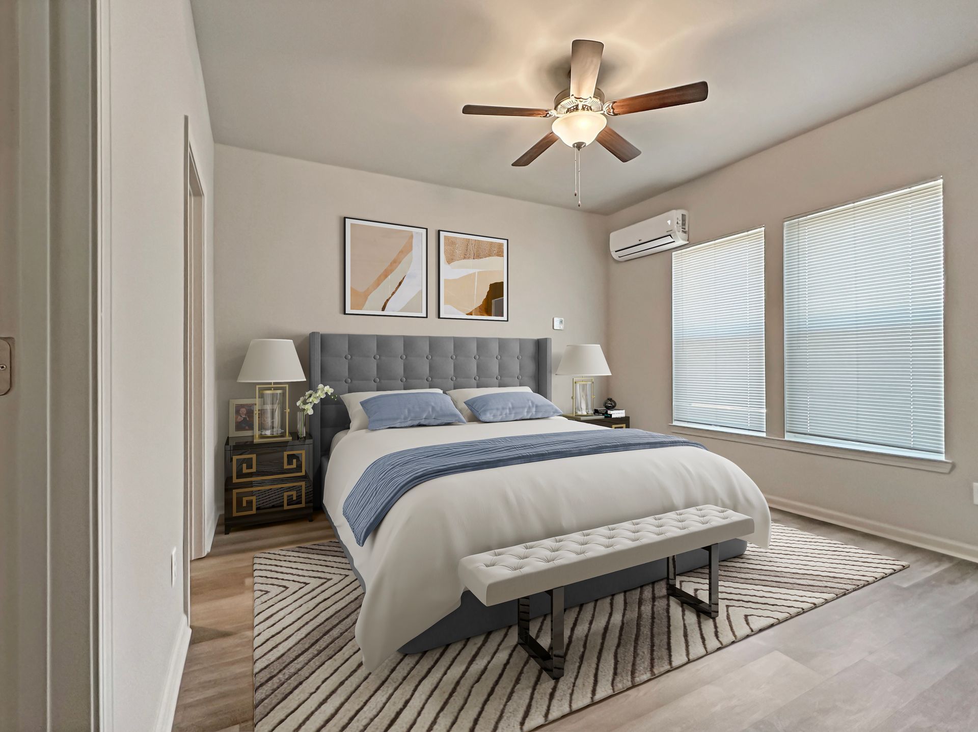 Bright bedroom with a bed, nightstands, ceiling fan, and large window blinds