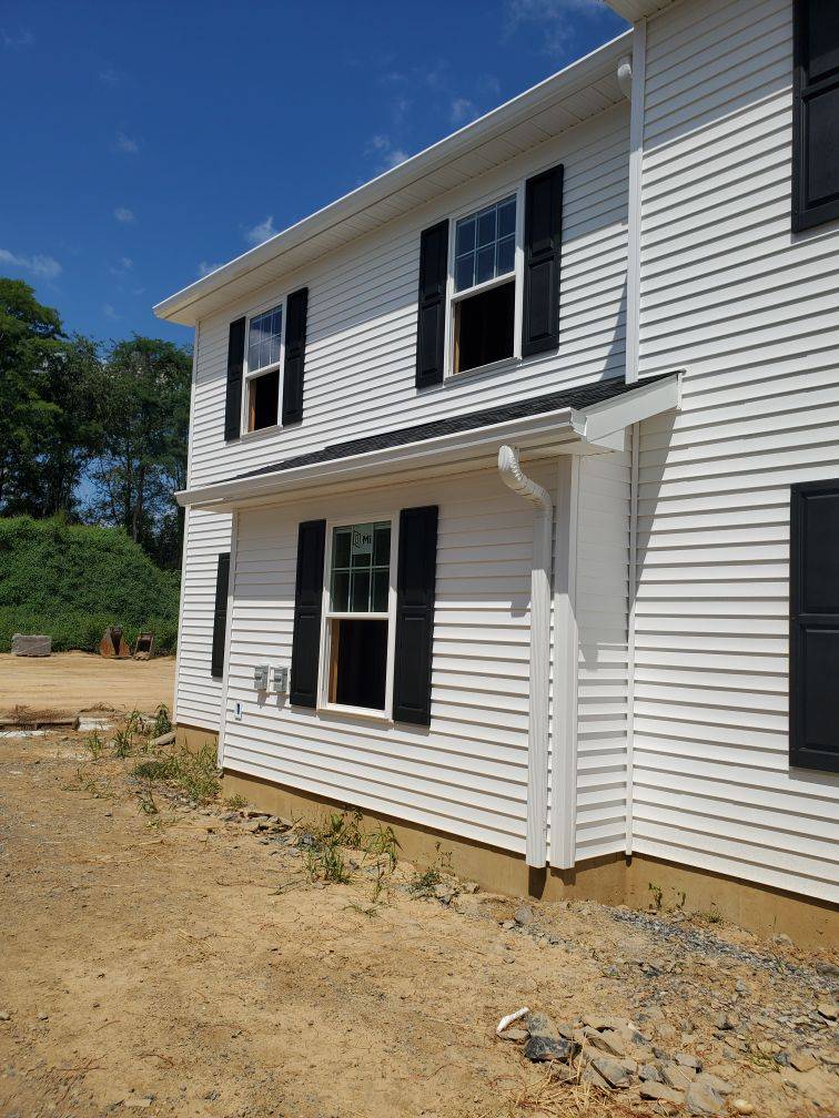 White House Exterior With Three Open Windows – Lititz, PA – Trailside Spouting, LLC