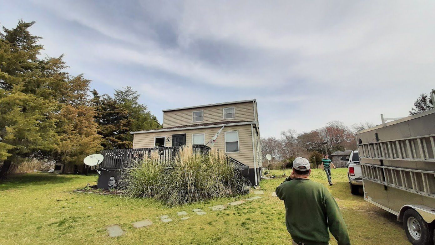 Man Walking on House Lawn – Lititz, PA – Trailside Spouting, LLC