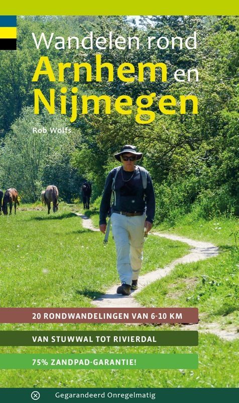 Man hiking on a path in Arnhem, Netherlands, book cover with text "Wandelen rond Arnhem en Nijmegen."