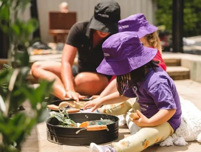 A Little Girl Wearing A Purple Hat And Dress — Shell Heights, NSW — Junior Einsteins