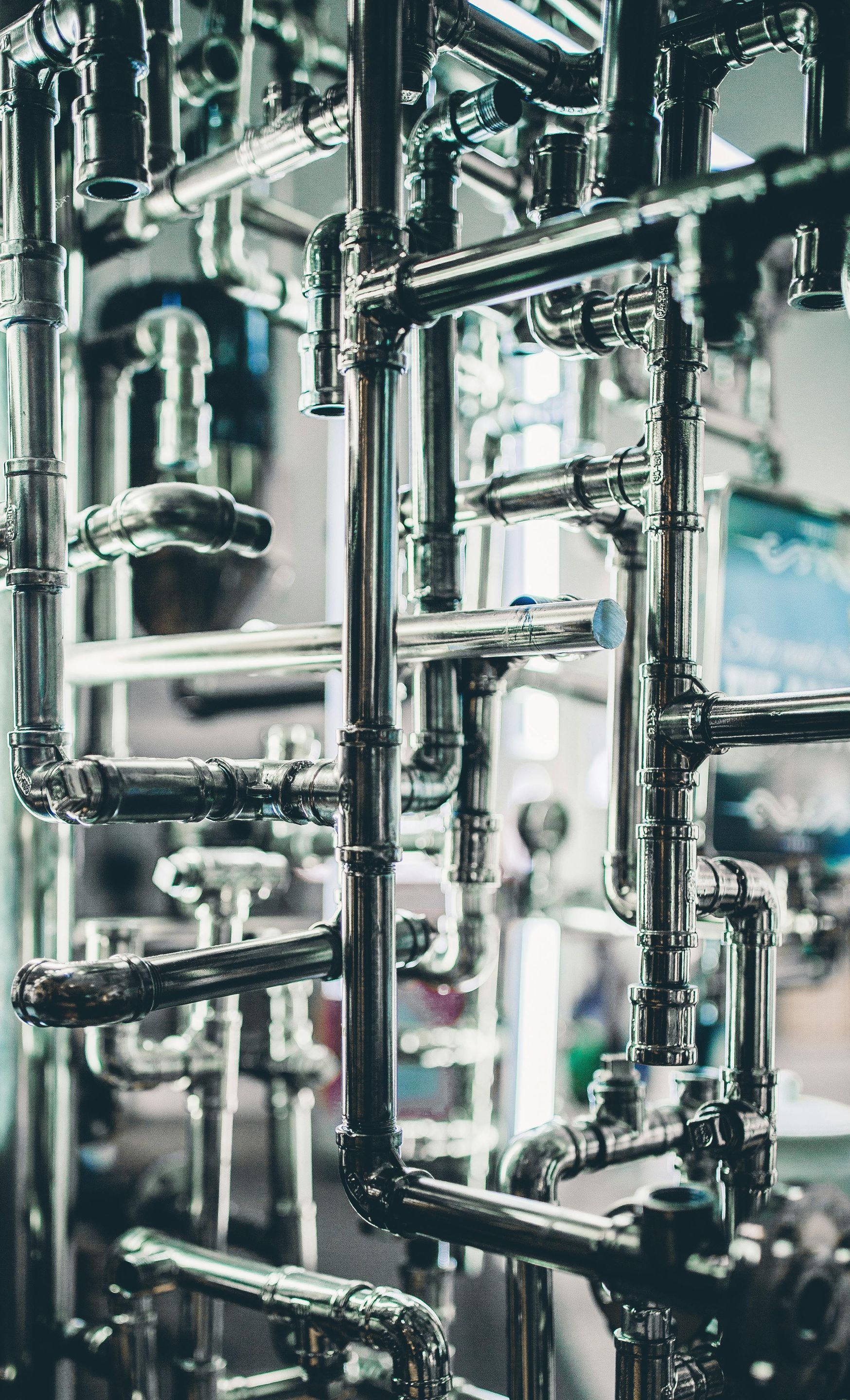 A bunch of pipes are stacked on top of each other in a factory.