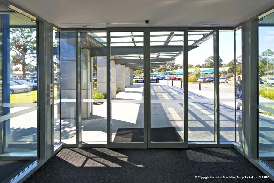 The Inside of a Building With Sliding Glass Doors — Superior Windows & Doors Taree, NSW