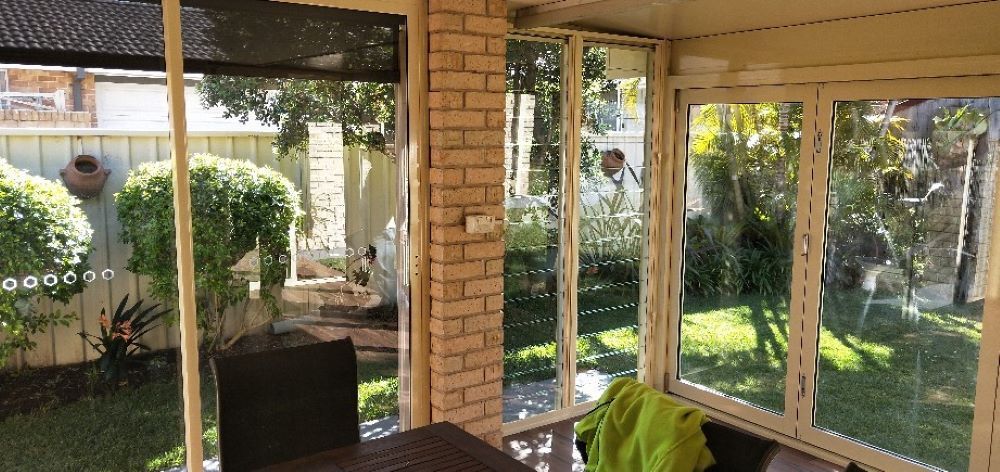 A Room With a Table and Chairs and a Lot of Windows — Superior Windows & Doors Taree, NSW