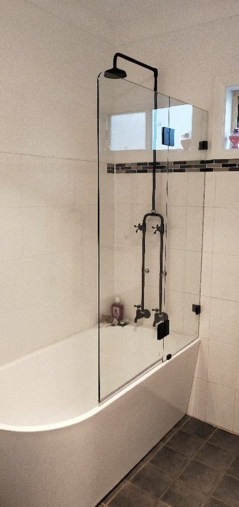 A Bathroom With a Bathtub and a Shower Stall — Superior Windows & Doors Taree, NSW