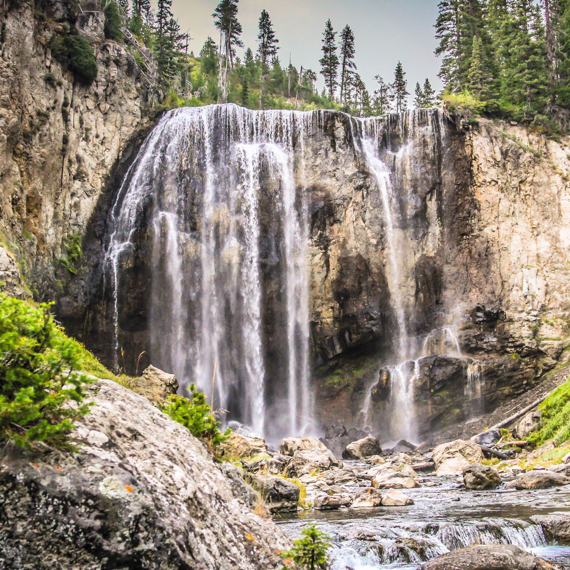 Boundary Creek Trail, Southwest Yellowstone Beautiful and delicate strands of water cascade over Dunanda Falls along the Boundary Creek Trail in Yellowstone.