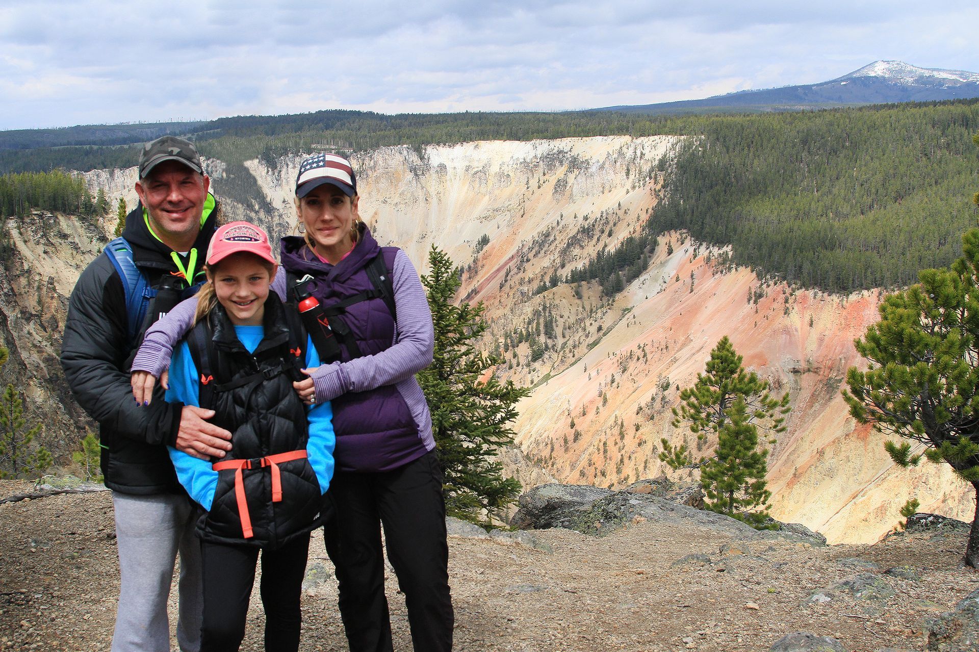 A family hiking the south rim of the Grand Canyon of the Yellowstone.