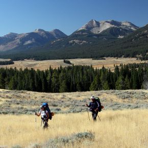 Fawn Pass Trail, Yellowstone Backpackers admire the view of Electric Peaks rugged profile during a guided tour in Yellowstone.