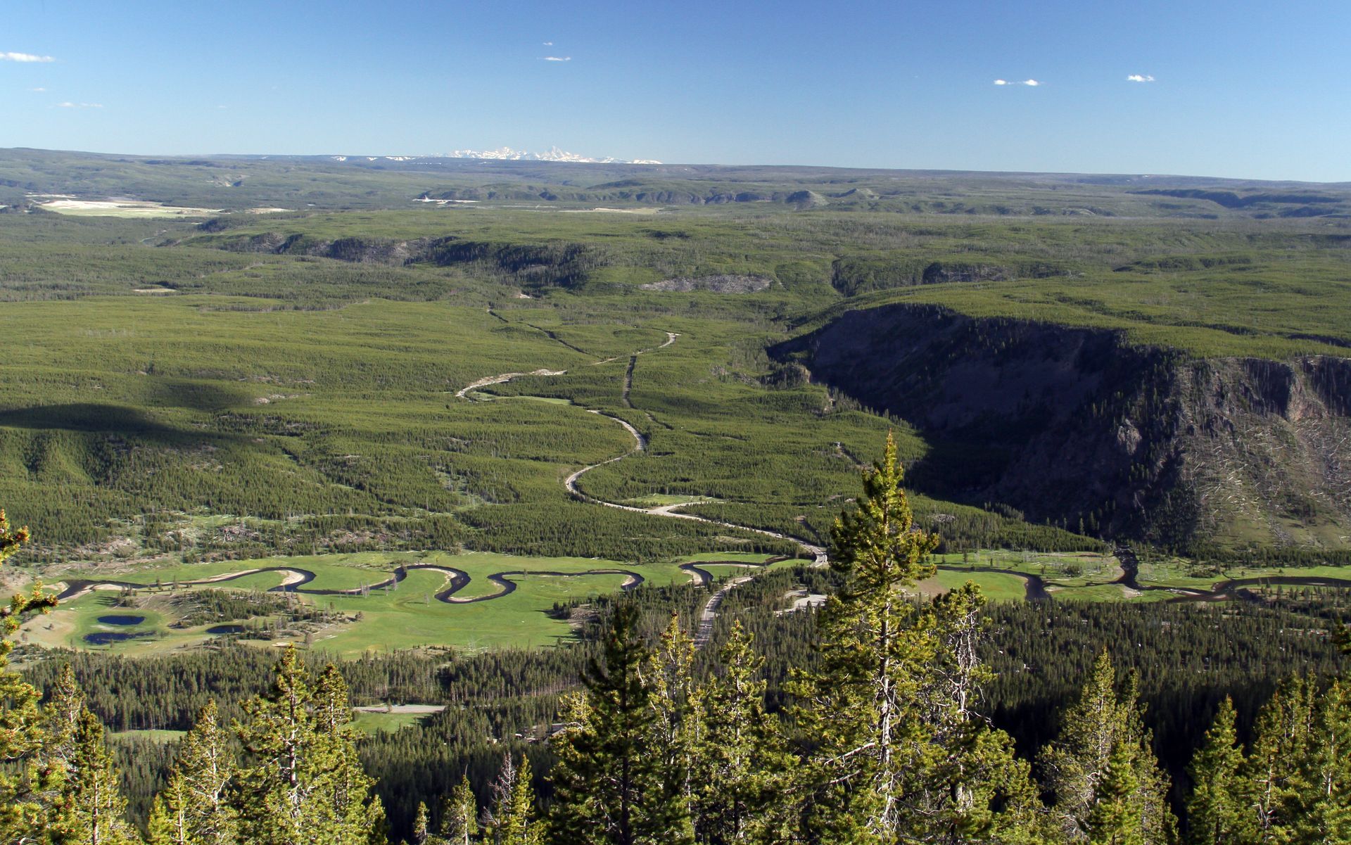 The snow capped peaks of the Grand Tetons are easily visible from the summit of Purple Mountain.
