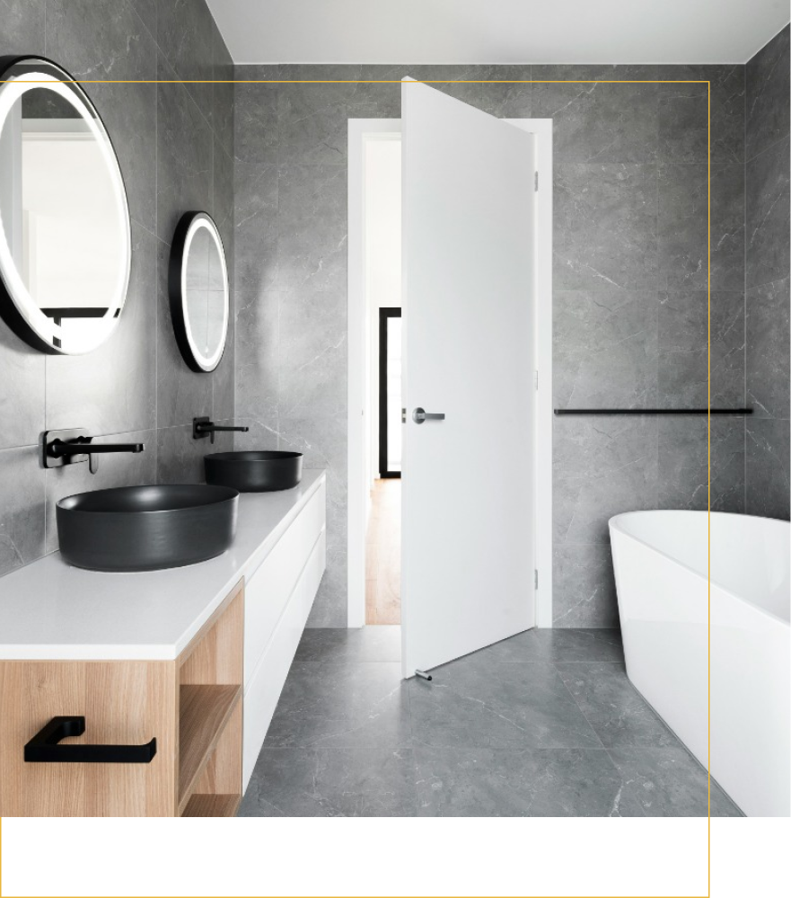 A bathroom with two sinks and a bathtub