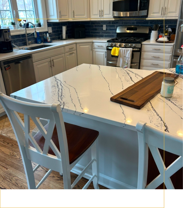 A kitchen with stainless steel appliances and white cabinets