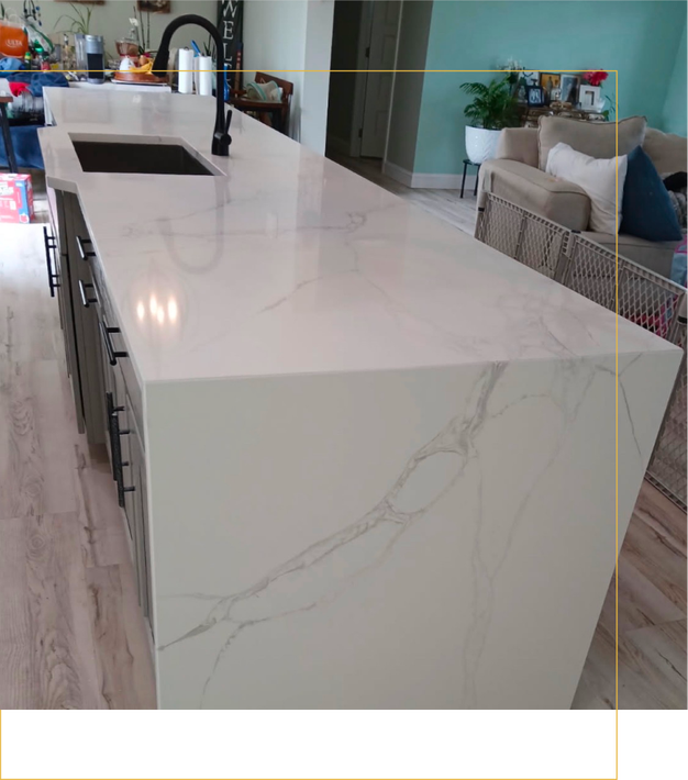 A kitchen with stainless steel appliances and white cabinets