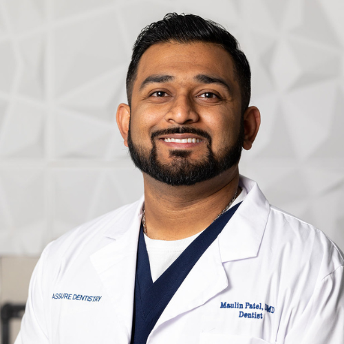 Man in white lab coat smiles, text: