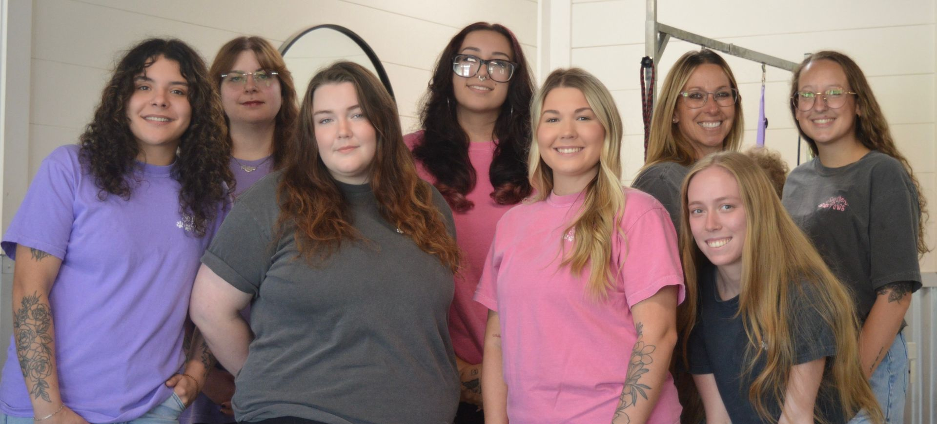 group photo of girls wearing colorful shirts