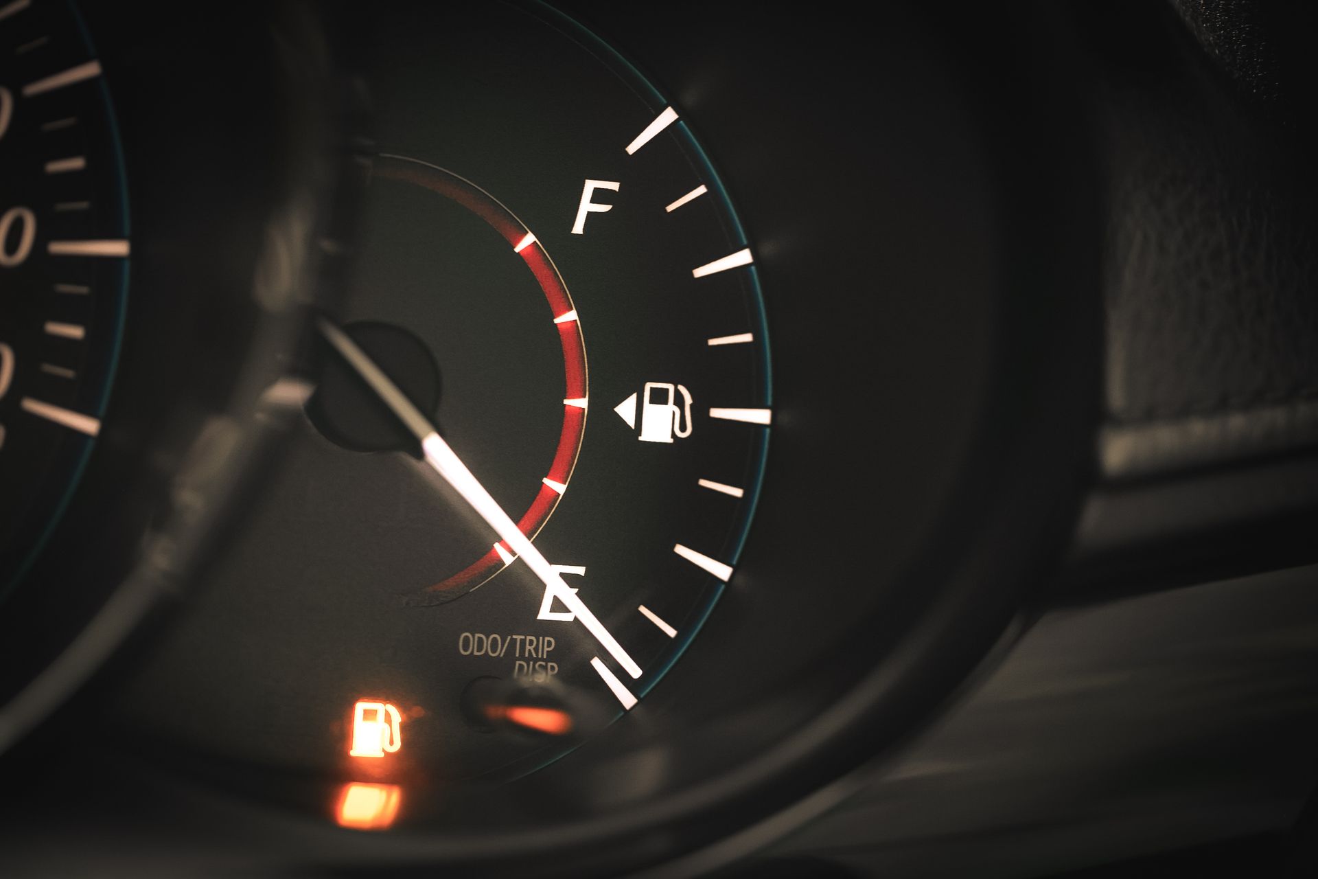 Dashboard low fuel gauge representing auto fuel gauge repair solutions for safer daily driving