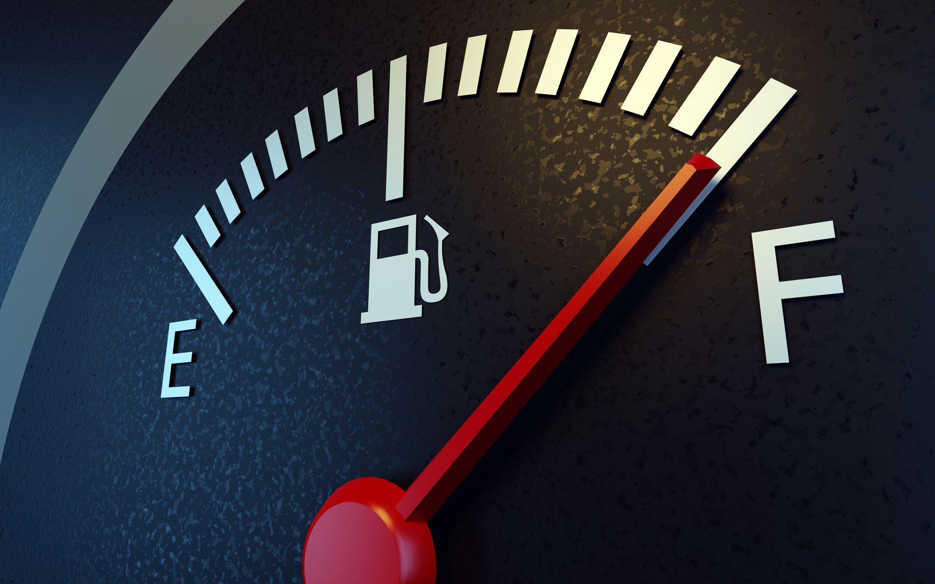 A car dashboard fuel gauge showing near full tank with red indicator needle. A car dashboard fuel gauge showing near full tank with red indicator needle.
