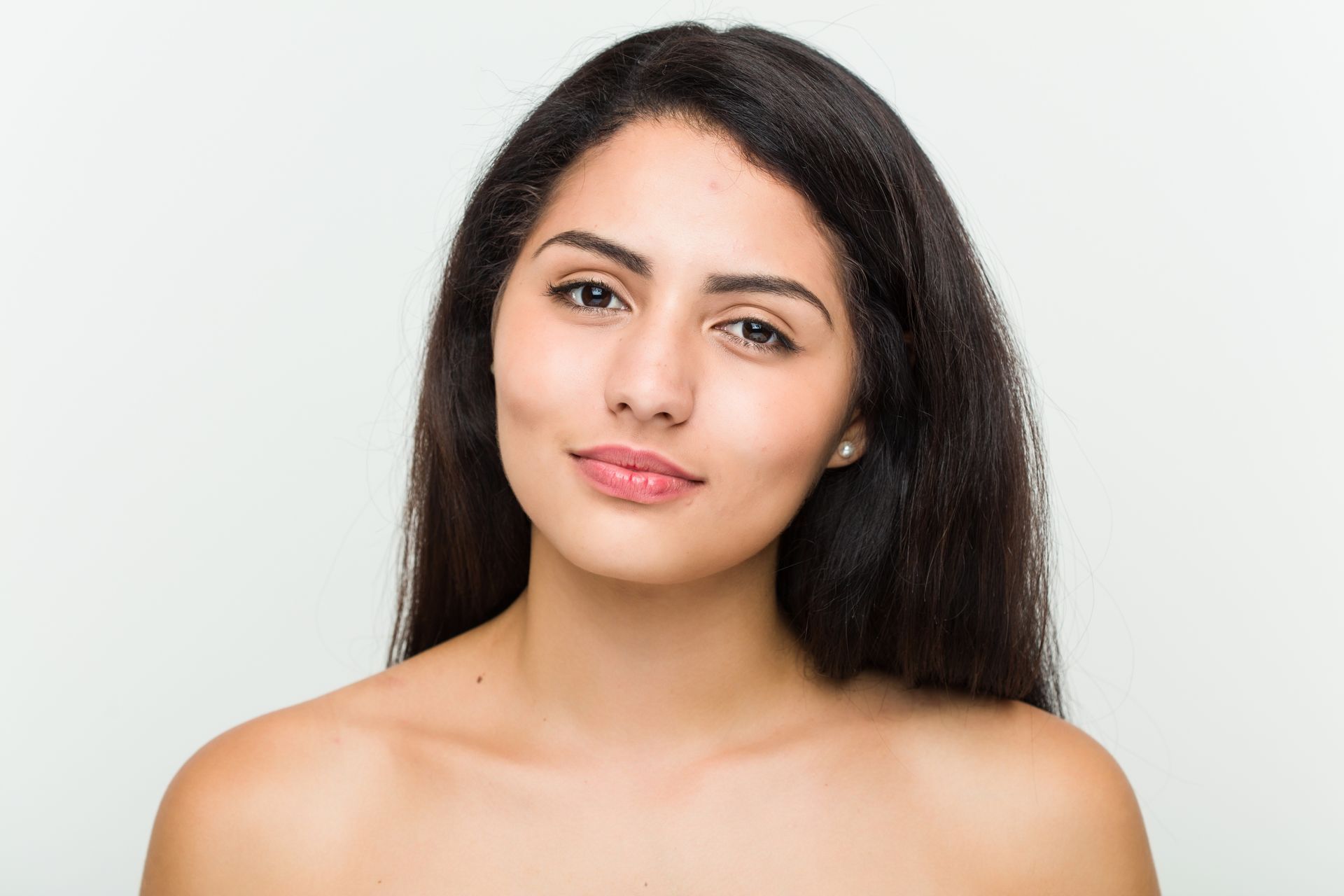 a woman without a shirt is looking at the camera