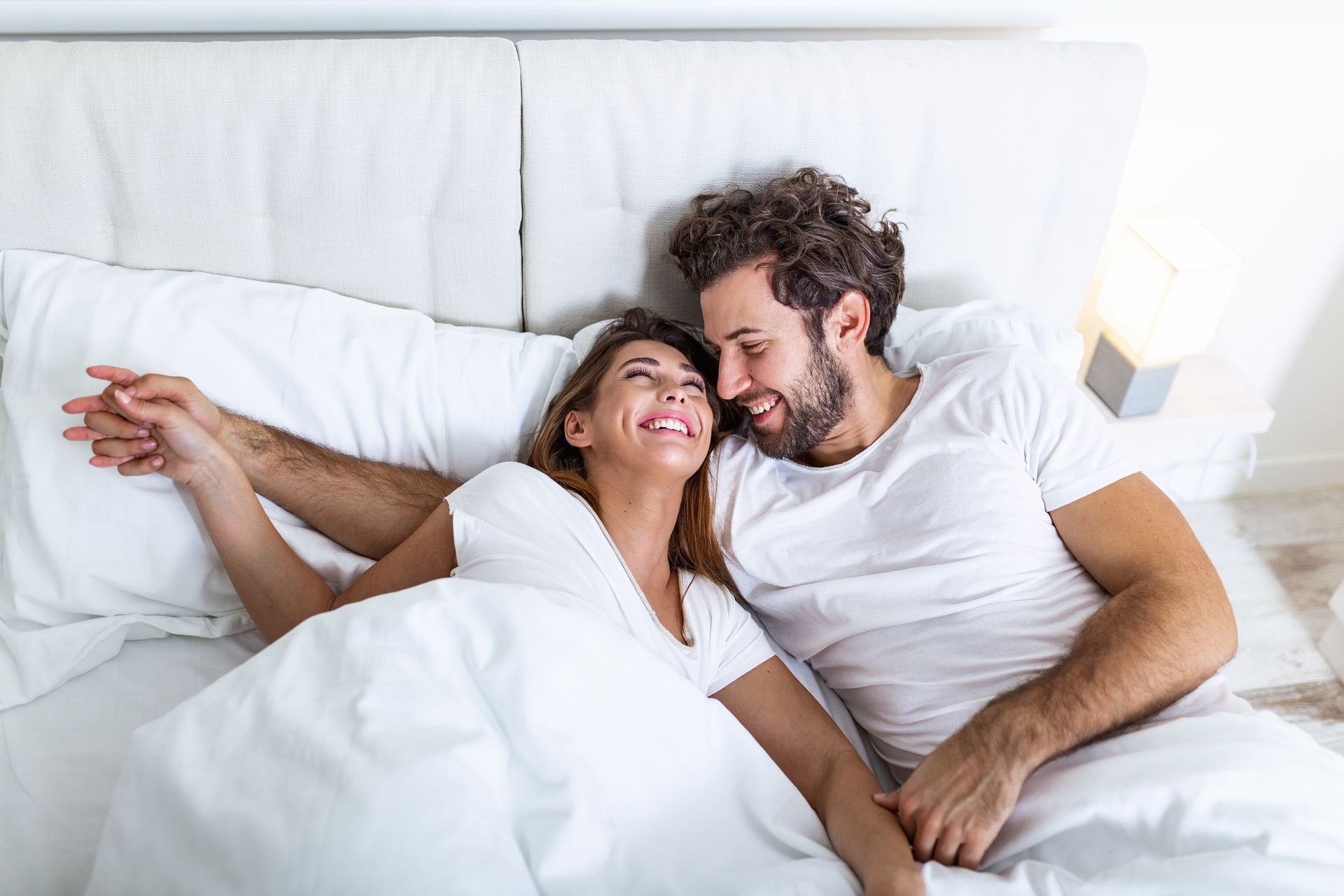 a man and woman are hugging and smiling for the camera