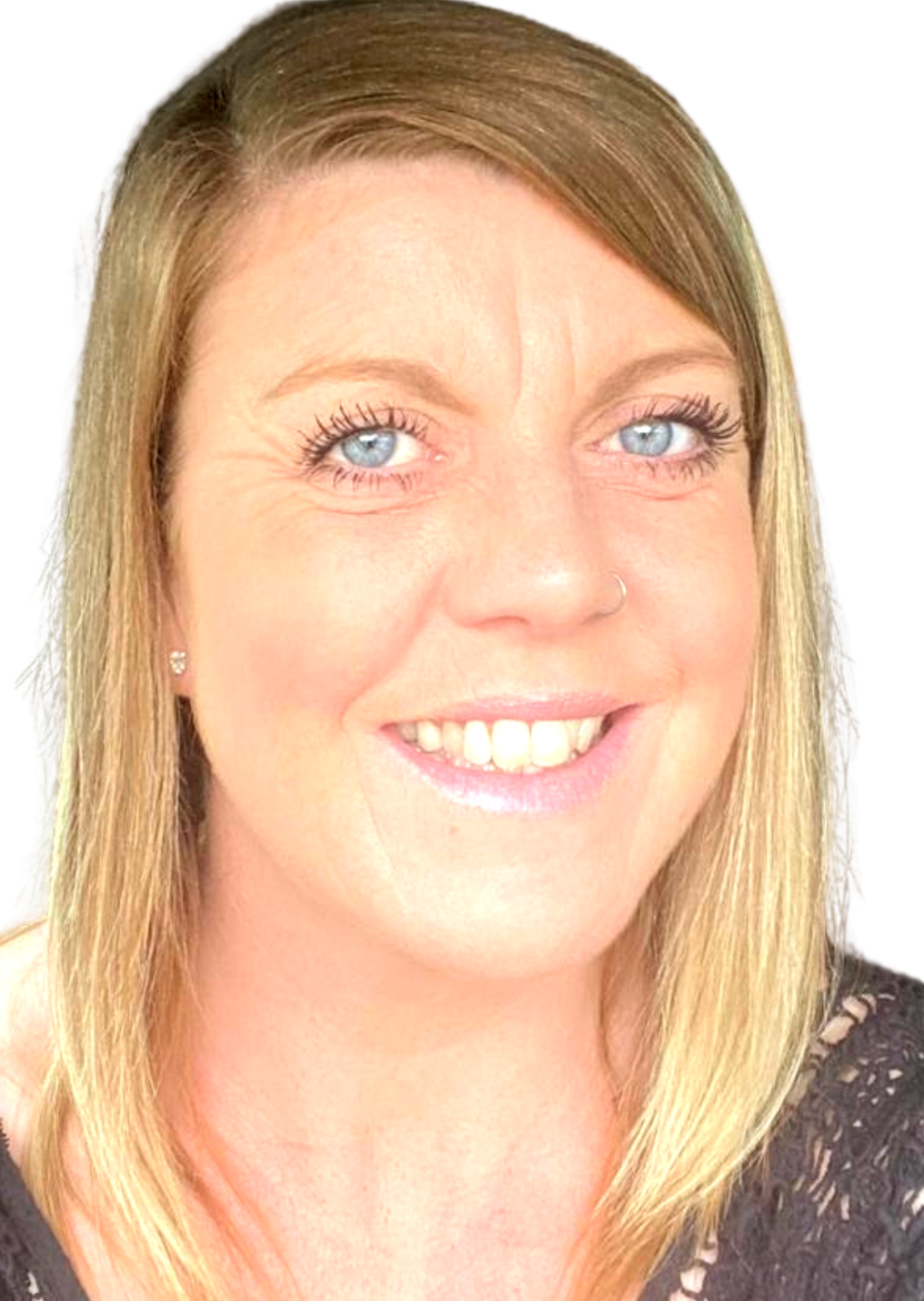 Woman with blonde hair and blue eyes smiles.