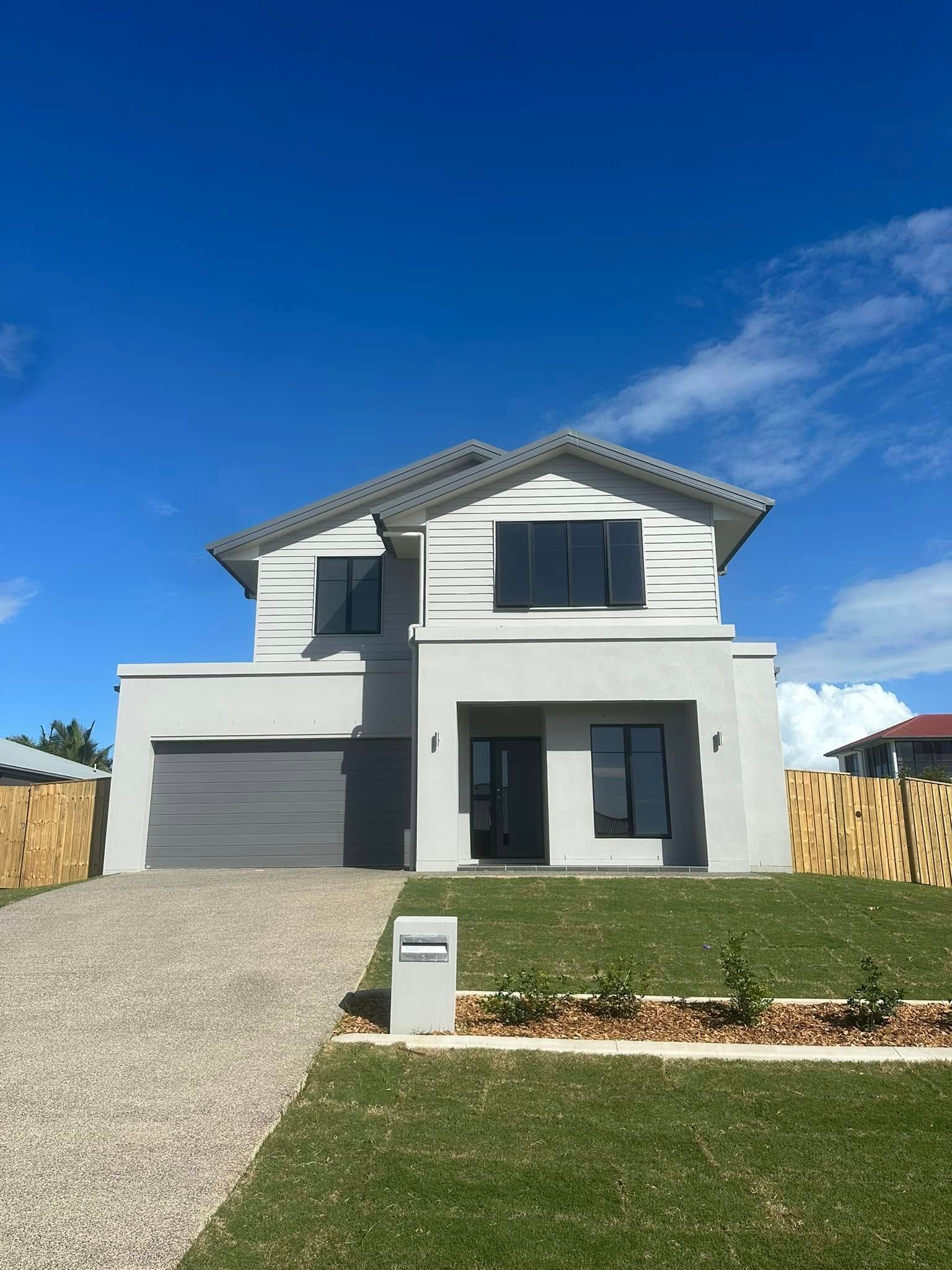 Two-story gray house with garage, black windows — Wide Bay Tinting in Kensington, QLD