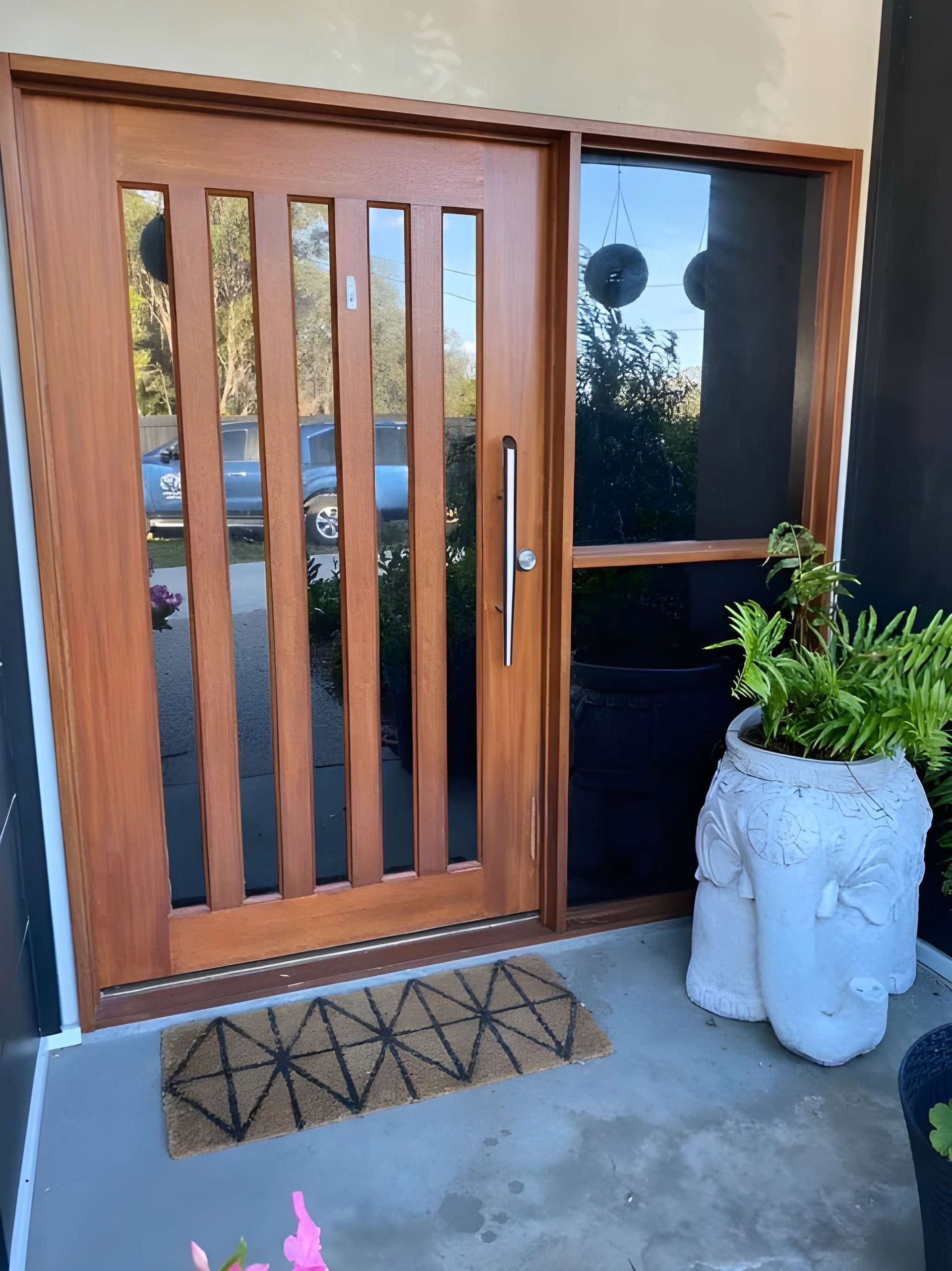 Wooden Front Door With Glass Panels and Sidelight — Wide Bay Tinting in South Kolan, QLD