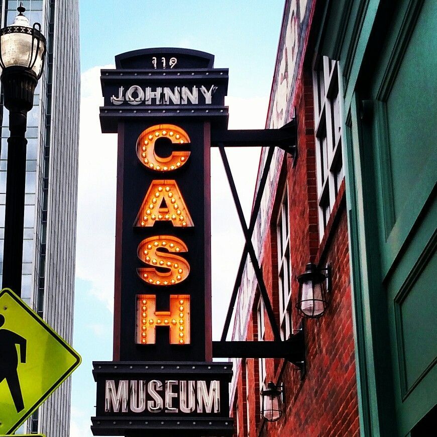 City Winery sign on a wooden wall against a blue sky