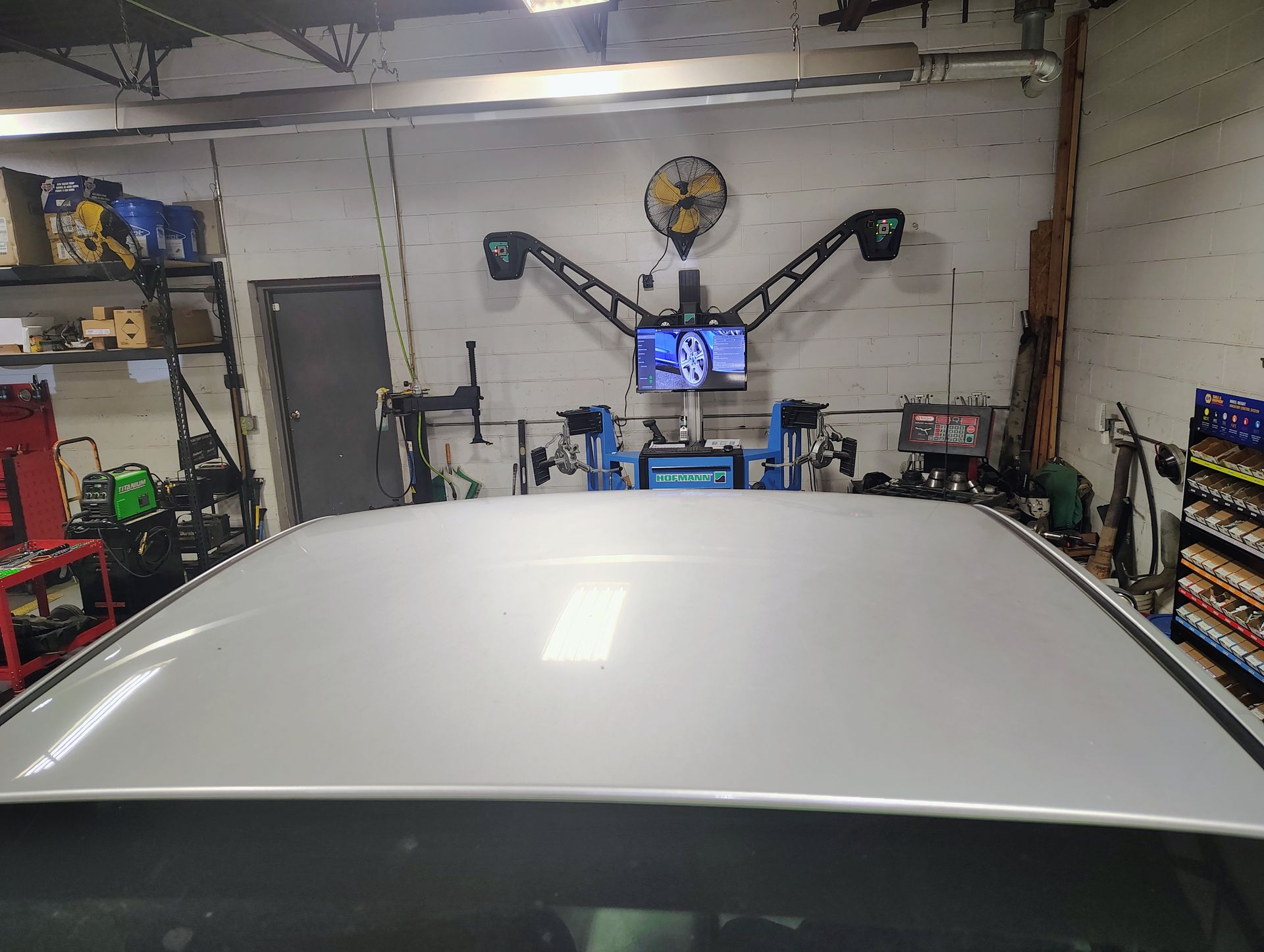 White car roof in a garage | MJ Auto Repair