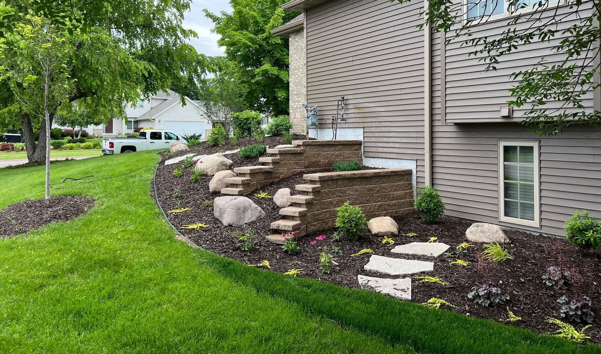 Block Retaining Wall | Landscape Maintenance | Natural Stone Steppers | Accent Boulders