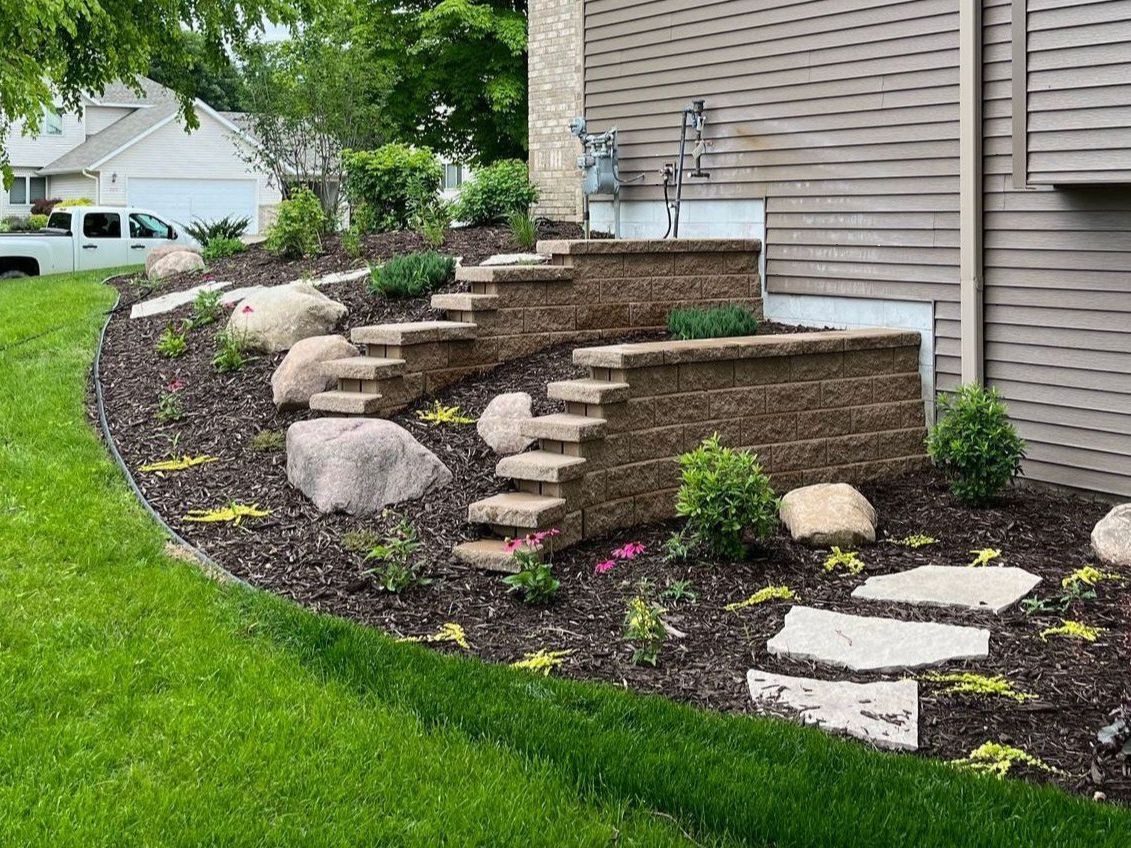 Hardscaping | Steppers | Boulder Retaining Wall