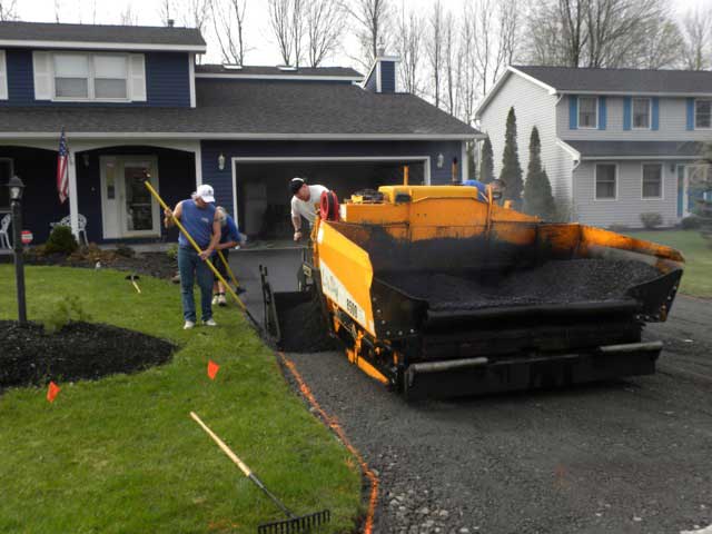 Spreading Asphalt Using A Machine — Syracuse, NY — Dependable Paving Co., Inc.