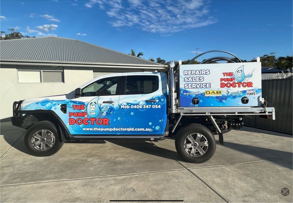 A Truck With the Word Doctor on the Side is Parked in Front of a House — The Pump Doctor In Kuluin, QLD