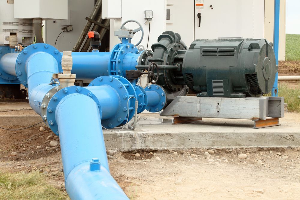 A Blue Pipe is Connected to a Black Motor — The Pump Doctor In Coolum, QLD