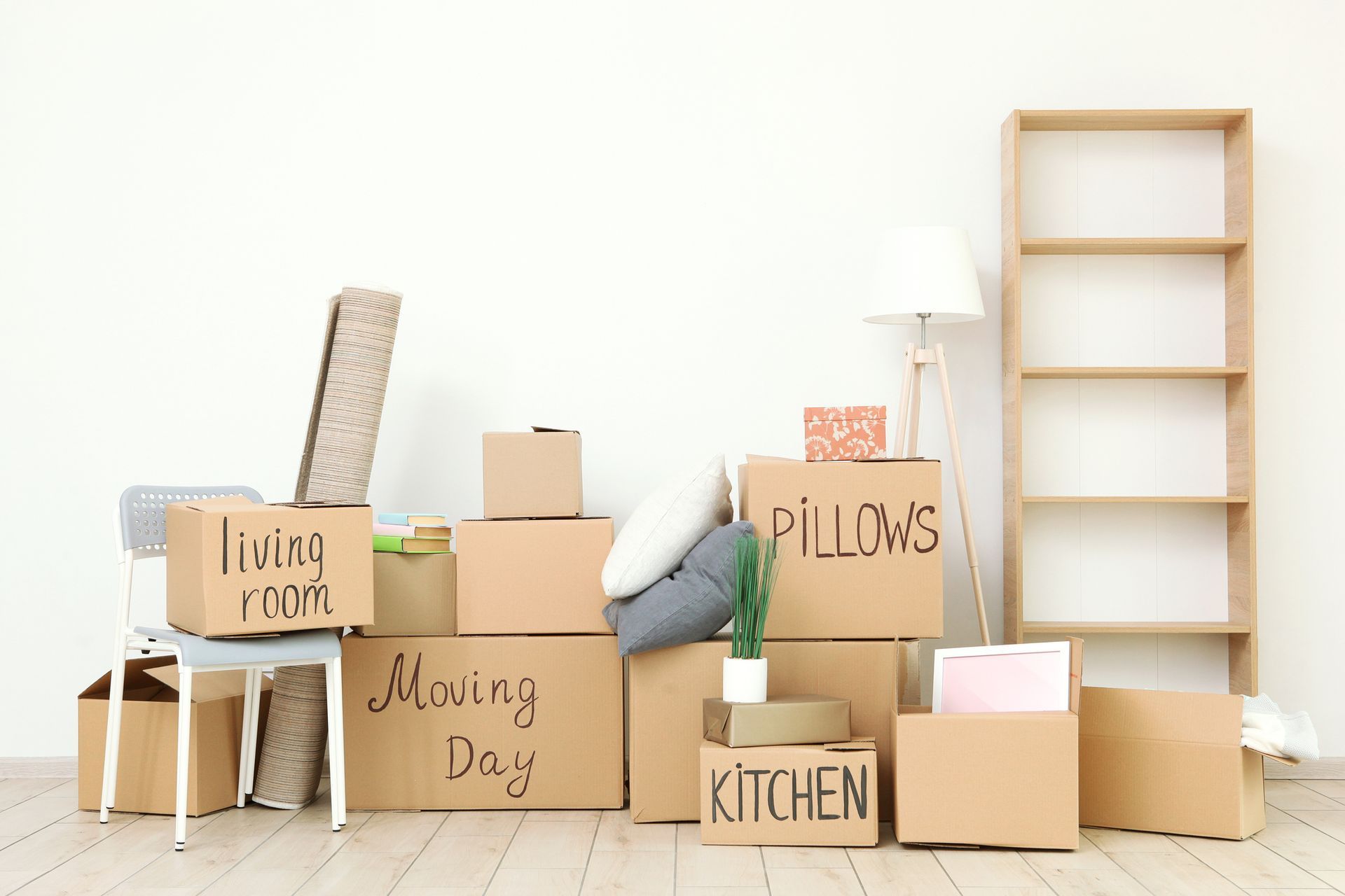 A Bunch Of Cardboard Boxes Are Stacked On Top Of Each Other In A Living Room — Aiken, NC — Aiken Junkmaster