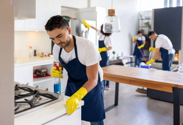 A Group Of People Are Cleaning A Apartment Together — Aiken, NC — Aiken Junkmaster