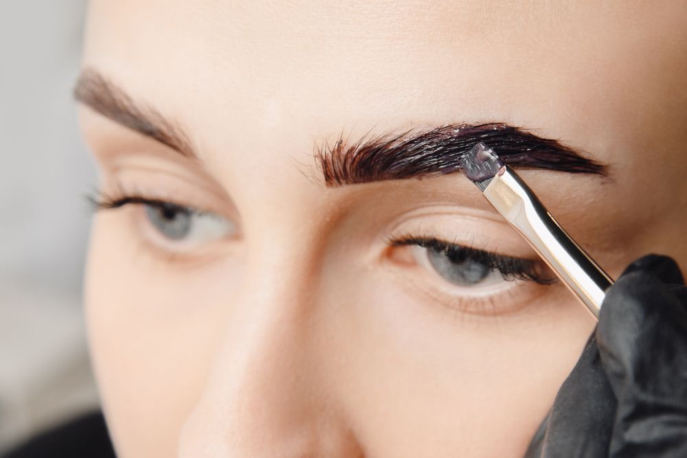 Brush With Tinting Cream Applied on Eyebrows — Villa Nails & Beauty in Airlie Beach, QLD