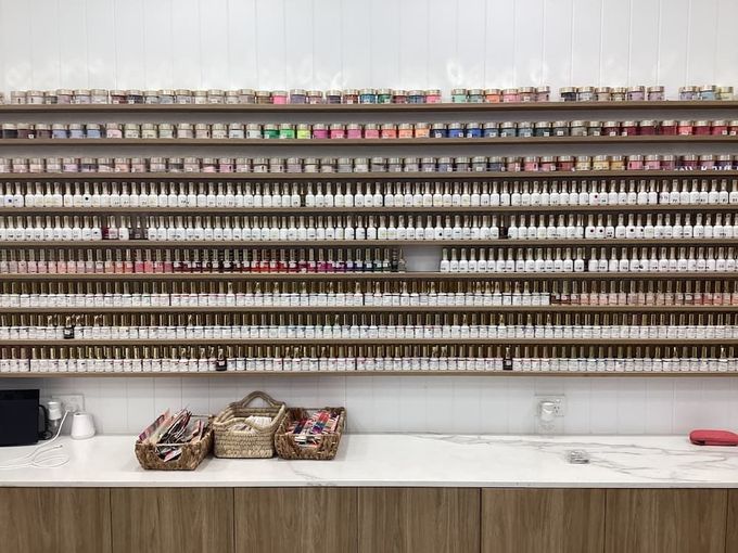 A Nail Salon with A Lot of Nail Polish on The Shelves — Villa Nails & Beauty in Cannonvale, QLD