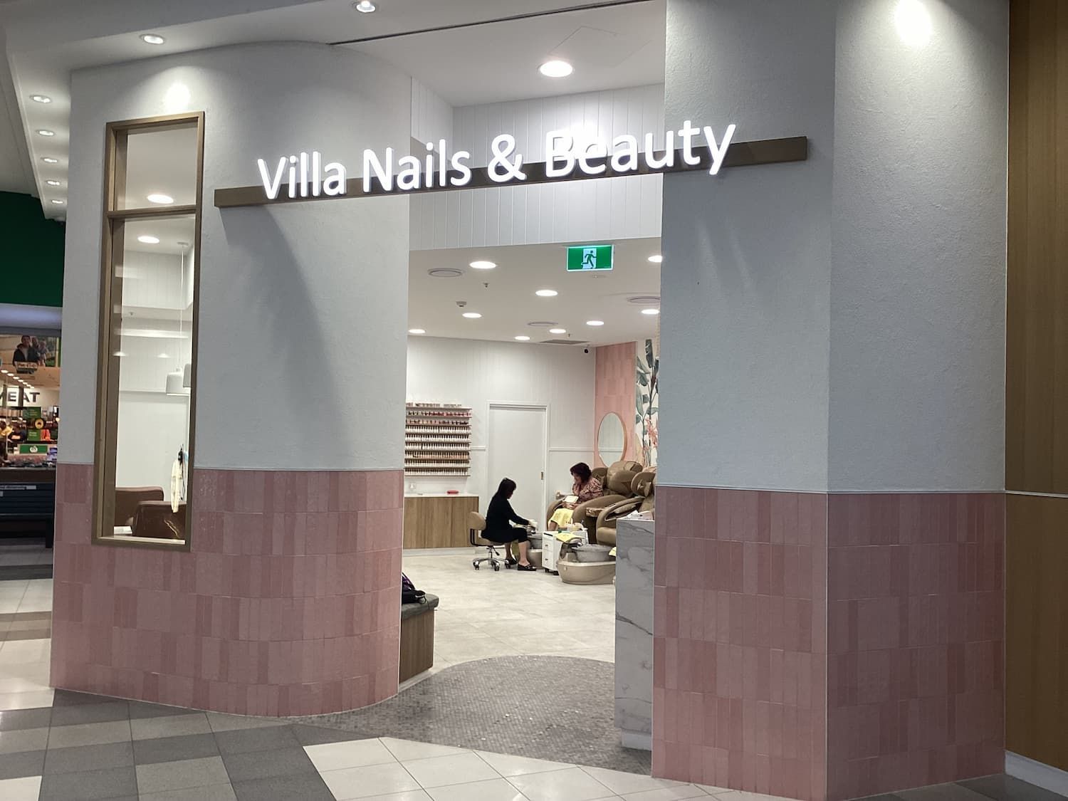 A Woman Is Getting Her Nails Done at Villa Nails and Beauty — Villa Nails & Beauty in Cannonvale, QLD