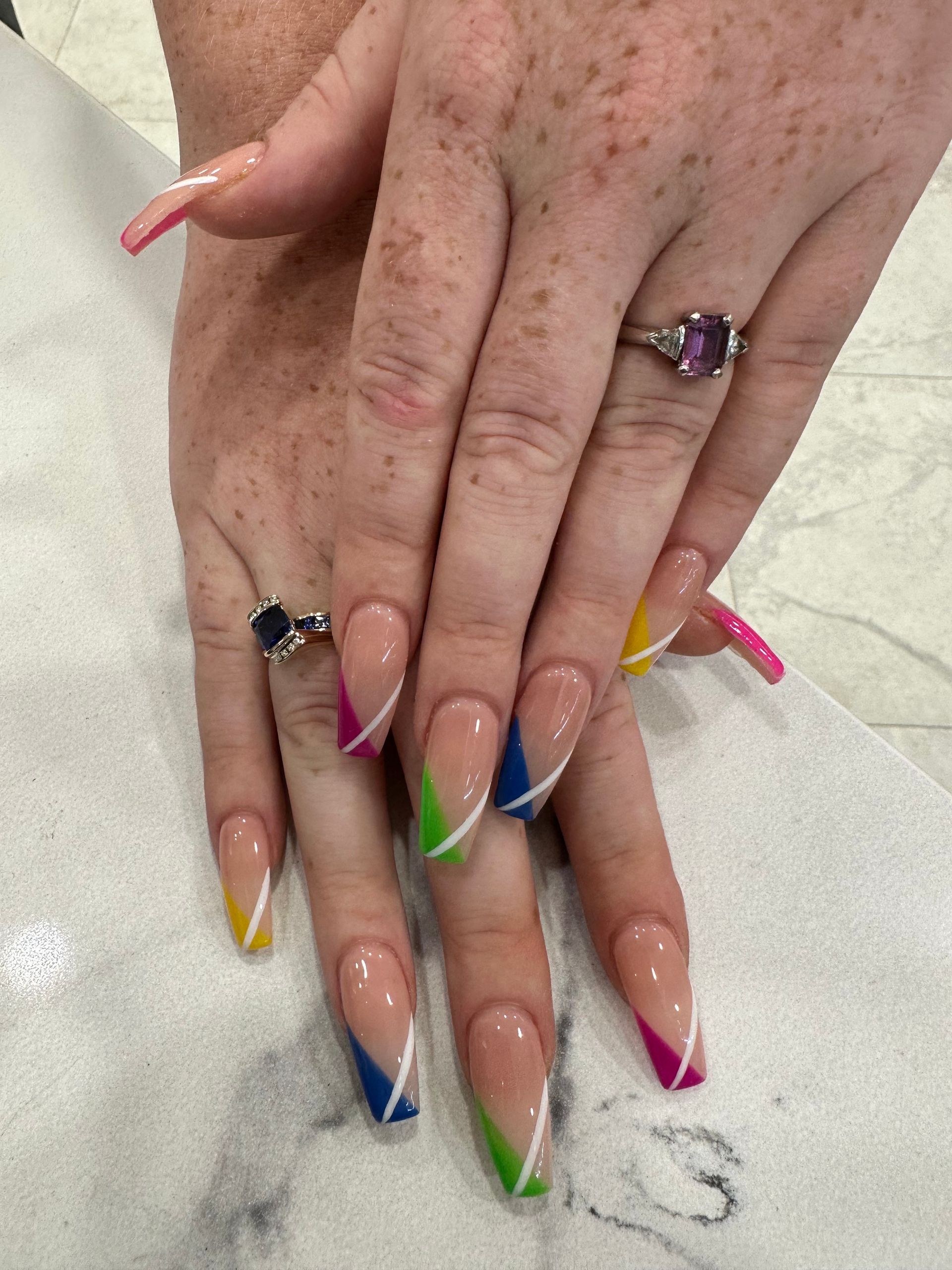 Hands with Long Multicolor French Tip Nails and Rings — Villa Nails & Beauty in Airlie Beach, QLD